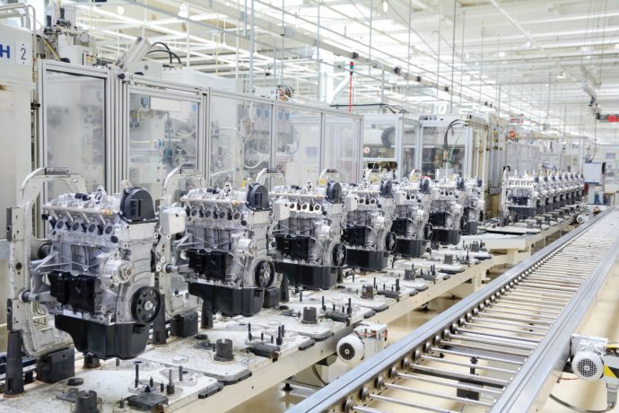 Schneider & Company - An assembly line of precision machinery in a modern, clean manufacturing facility.