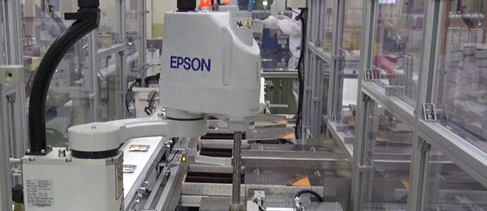 Schneider & Company - Robotic precision at work: an epson robotic arm swiftly assembles products on a modern automated production line.