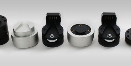 Schneider & Company - A collection of six different industrial electrical connectors with varying designs displayed in a row against a gray background.